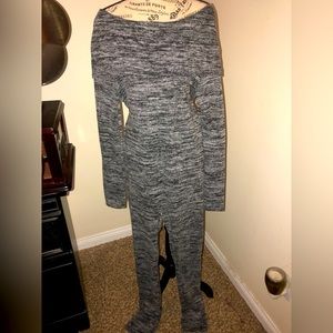 Chic dark heather grey, poly/rayon jumpsuit. Off-shoulder feature. Size large